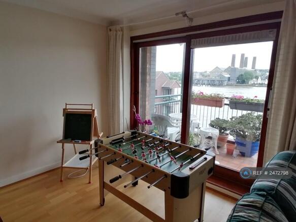 Living Room With View Of Balcony