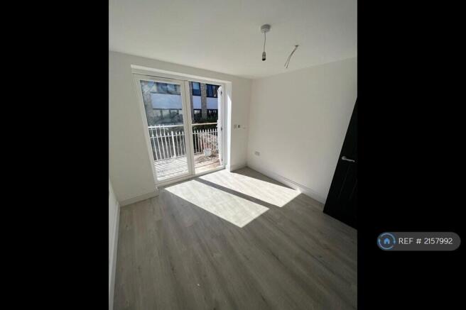 Bedroom With Balcony