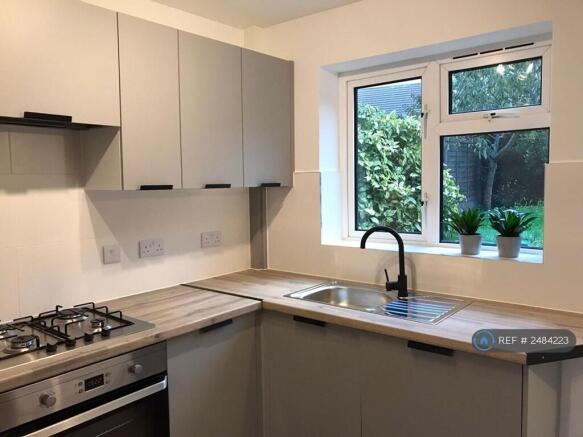 Kitchen With Fridge And Dishwasher 