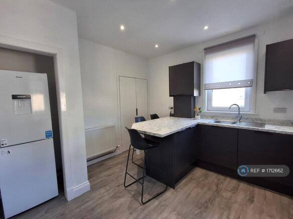 Kitchen With Fridge/Freezer And Washing Machine