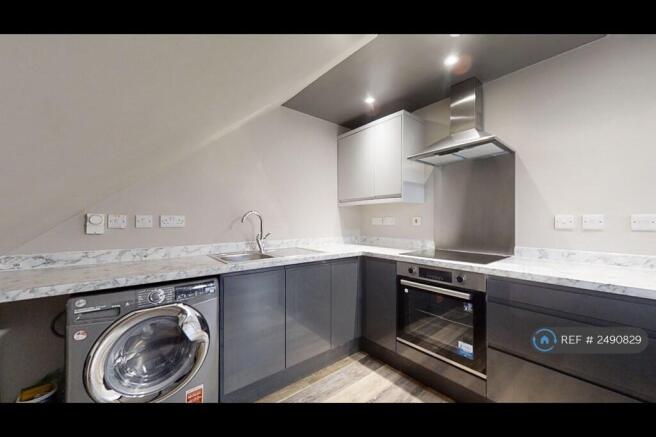 Modern Kitchen With Induction Hob And Oven