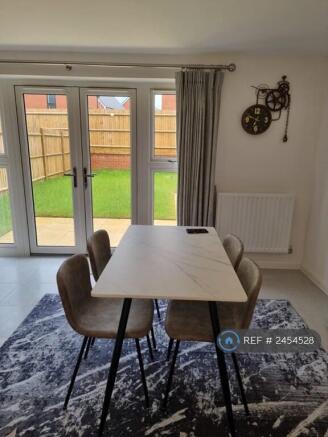 Living Room With Dining Table And Sofa