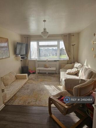 Living Room With Park And School View