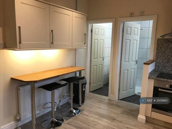 Large Kitchen With Breakast Bench And Table
