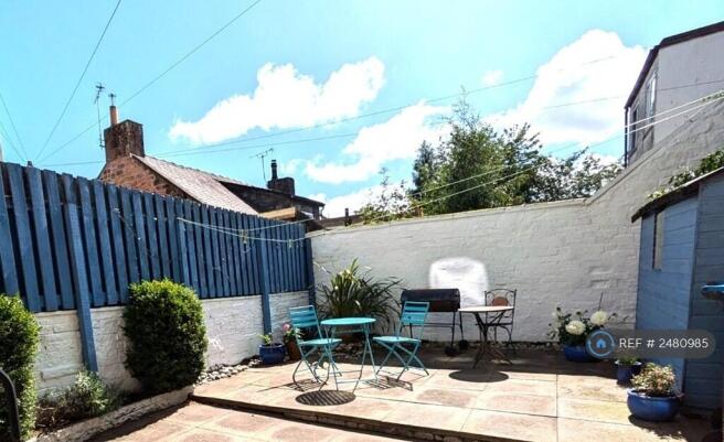 Sunny Yard With Bike Shed