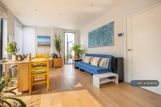 Living Room With Door To Balcony