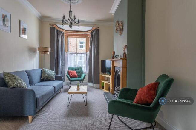 Welcoming Lounge With Fireplace And Dining Area