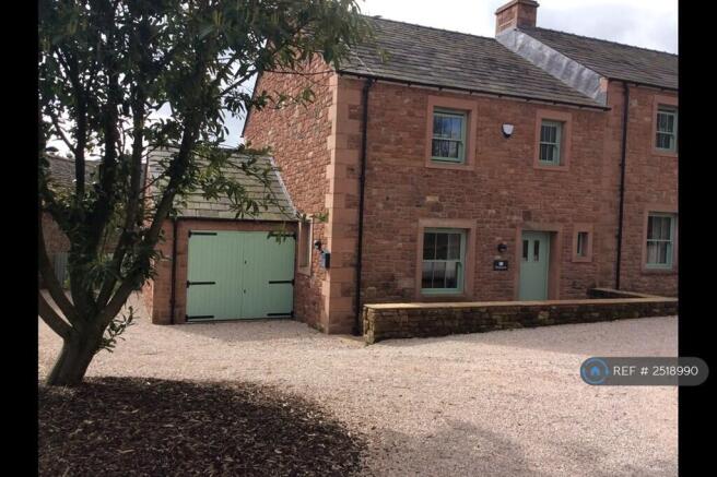 Front View Of Garage And Private Parking
