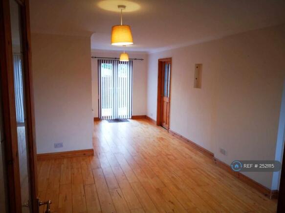 Lounge With Patio Door To Garden