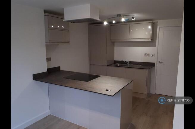 Well Designed Kitchen With Breakfast Bar