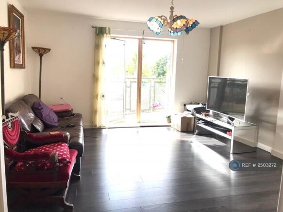 Park View Living Room With Balcony
