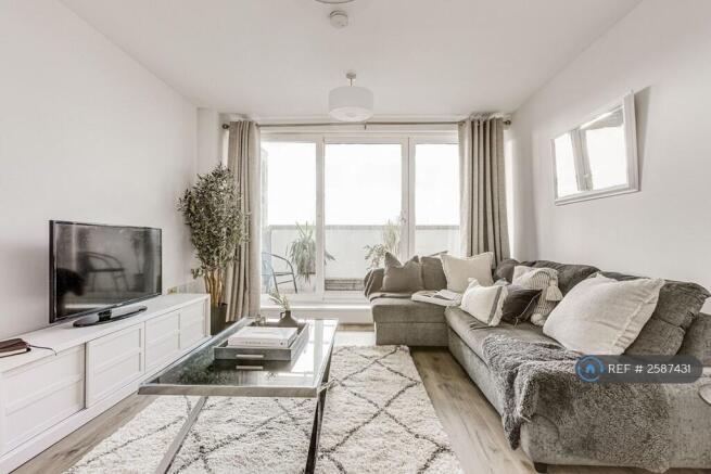 Living & Dining Room With Sunset Balcony Views