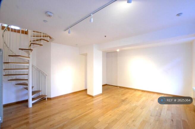 Living Room With Spiral Staircase