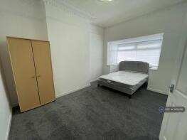 Spacious Bedroom With a King-Size Bed