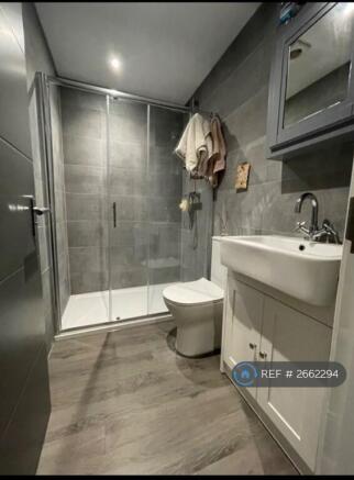 Ensuite Bathroom With Walk-In Shower Loo And Basin