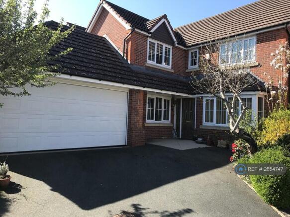 Front Of House, Garage And Driveway