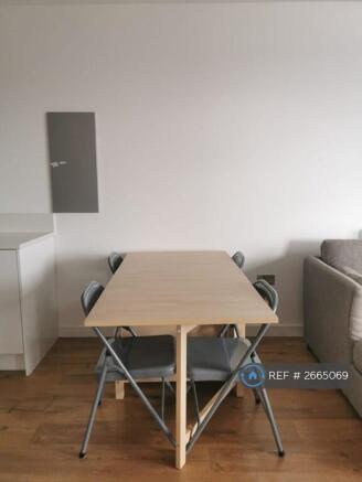 Dining Table In Between The Kitchen And Living Rm