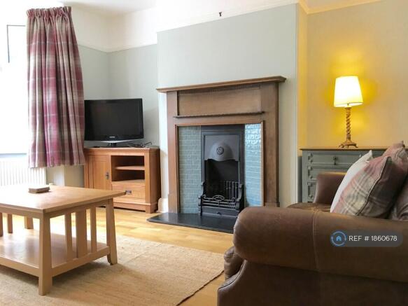 Large Sitting Room With 2 + 3 Seater Leather Sofas