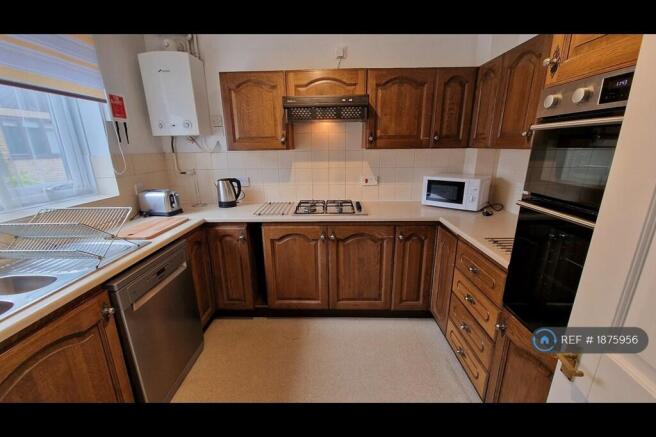 Kitchen With Dishwasher & Large Fridge Freezer