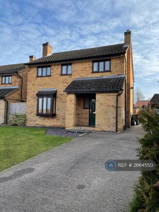 Front View Drive Leading To Double Garage