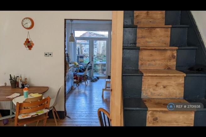 Entrance & Stairs With View Through To The Kitchen