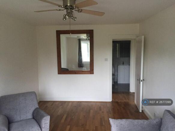 Living Room With Windows Out To The Common