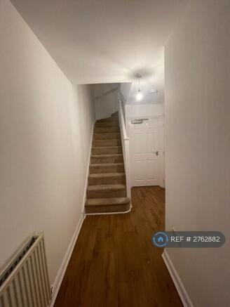 Hallway Leading To Stairs