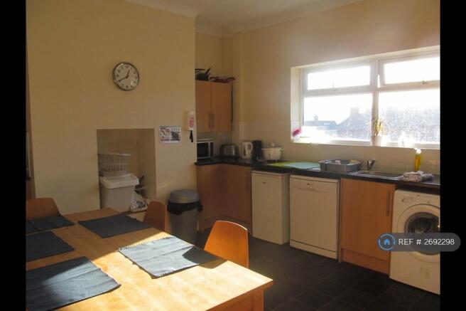 Kitchen With Dishwasher Washer Freezer And Fridges
