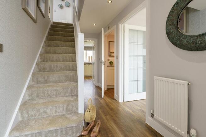The Shelford has a bright and spacious hallway with under stairs storage