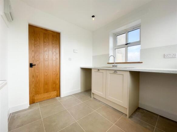 ENTRANCE PORCH/ UTILITY ROOM