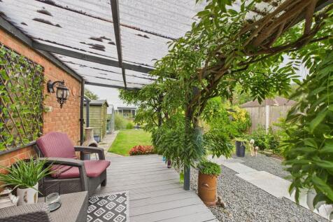 Covered seating area by the garage