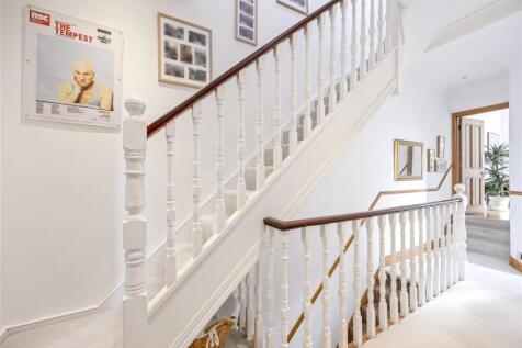 Stairs rising to Second Floor