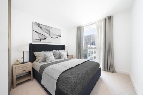 Transform your nights in this chic bedroom, featuring a plush bed and captivating city views.
