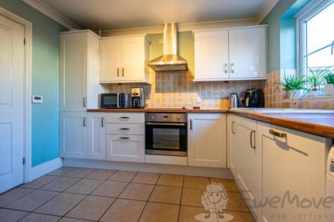 Bright Kitchen with Ample Storage and Floor Space