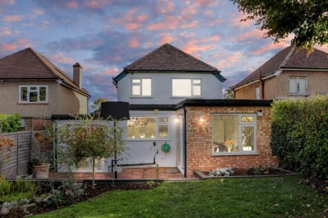 Rear view of the property at dusk