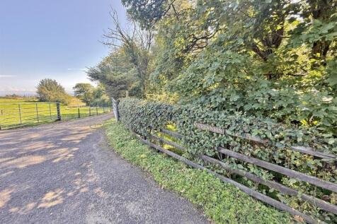 Auchenwhin sign and driveway from the main road