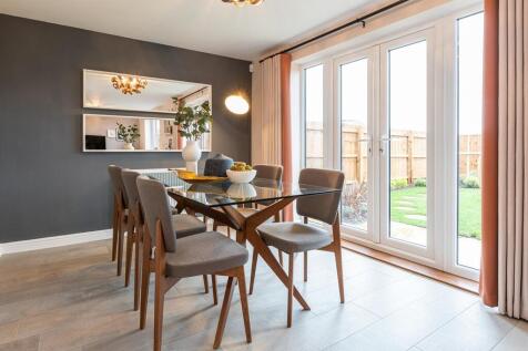 Double doors lead from the dining area to the garden, perfect for al fresco dining