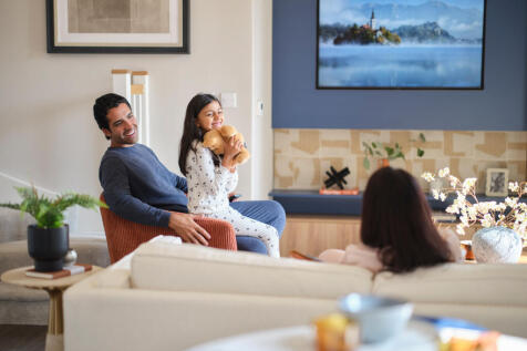 Family laughing in living room