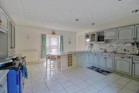 Kitchen with patio doors and bay window