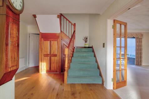 Entrance hall with wide stairs &amp; storage