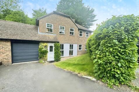 Outside View Of The Property With Driveway Parking