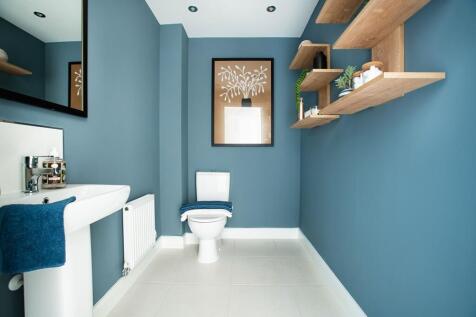 A spacious and convenient downstairs toilet is central to the home