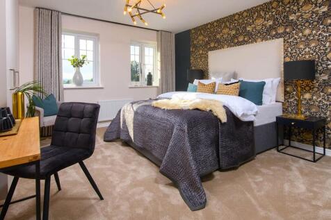 Spacious main bedroom, flooded with light from a large window