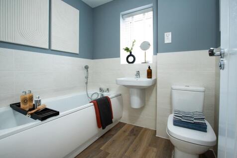 A modern family bathroom with smart features for saving water and energy.