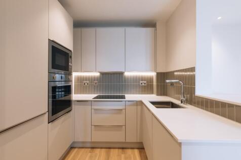 Experience style and efficiency in this sleek modern kitchen, perfect for culinary enthusiasts.