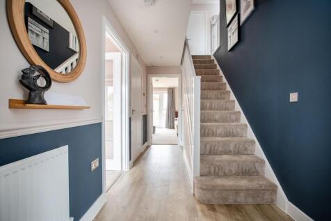 The central hallway with under stairs storage