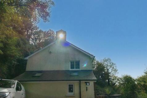 Sun shining through the old school bell tower