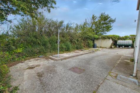 Rear patio and drive