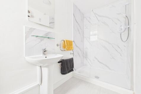 Self-contained flat shower room