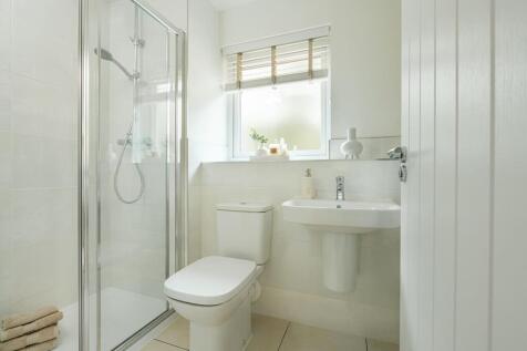 The main bedroom has its own en-suite shower room